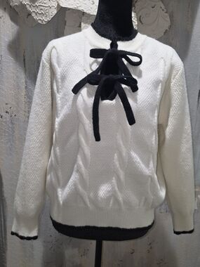 Listicle Feminine Cream Cable-Knit Sweater with Black Bow-Front Detail